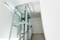 Homelift with glass shaft in the staircase