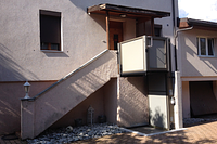 vertical platform lift outside easy access to multi family home