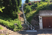 Platform lift serves residential building and street
